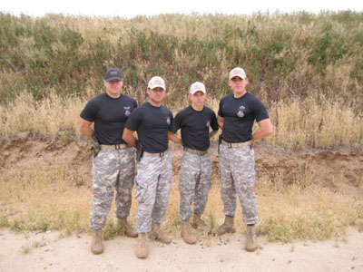 Zach Hartley (left) who led the Titan Battalion in action pistol training with SF 78.